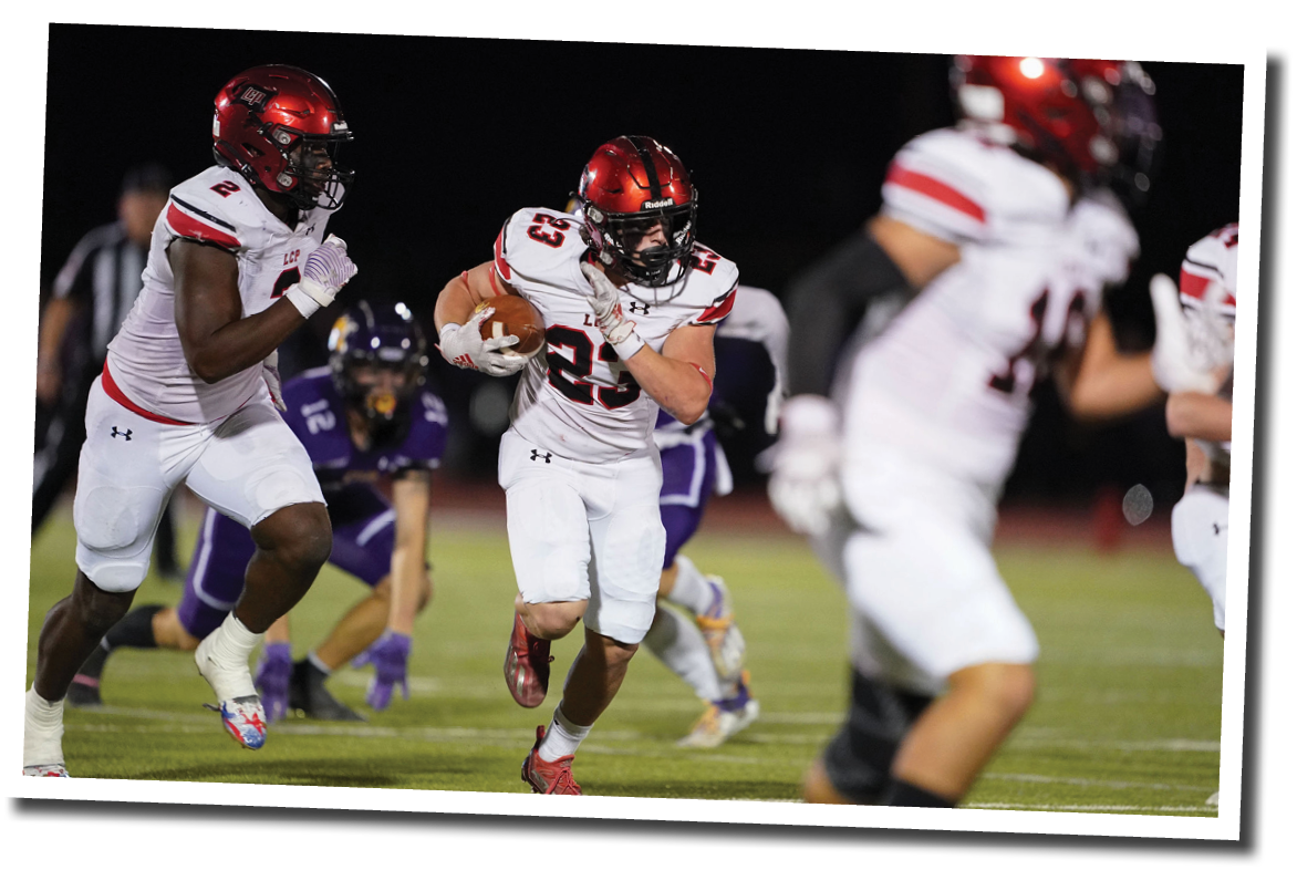Kyle Lewis (23) grabs a tipped ball for an interception and turns upfield with a Pirate escort  Lubbock-Cooper vs  Abilene Wylie  Photo by: Aaron Baxter