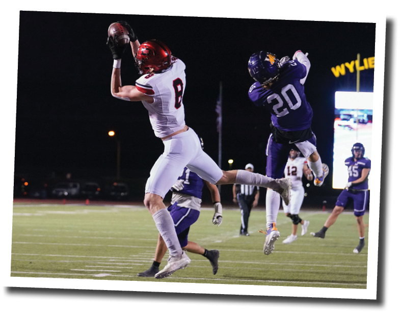 Brady Barnett hauls in a pass from Holt Gibson off of a bootleg  Lubbock-Cooper vs  Abilene Wylie  Photo by: Aaron Baxter