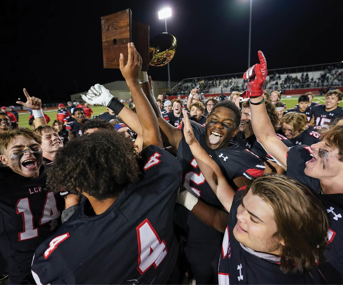 The Pirates hoist their fourth consecutive district championship trophy in the air  Lubbock-Cooper vs  Randall  Photo by: Aaron Baxter