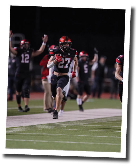 Callan Ritz (27) turns up the sideline with blockers on a long punt return for a touchdown  Lubbock-Cooper vs  Randall  Photo by: Aaron Baxter