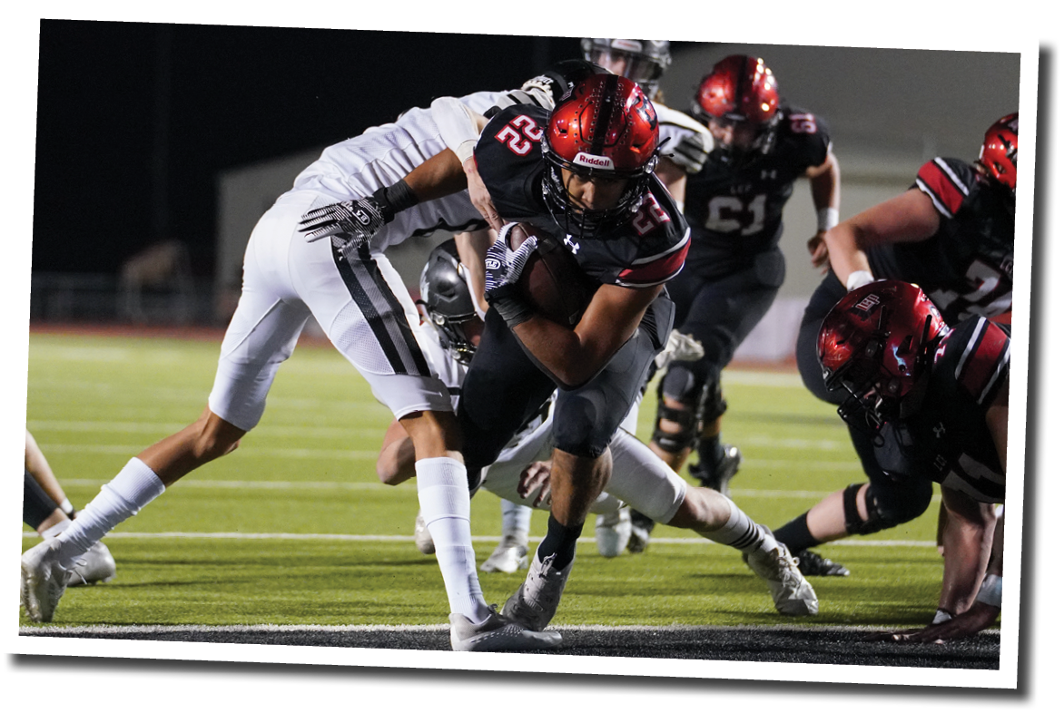 Kaleb Stripling (22) slips past the line and into the endzone  Lubbock-Cooper vs  Randall  Photo by: Aaron Baxter