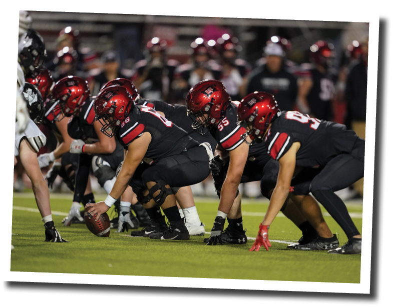 The Pirate offensive line prepares for the snap  Lubbock-Cooper vs  Randall  Photo by: Aaron Baxter