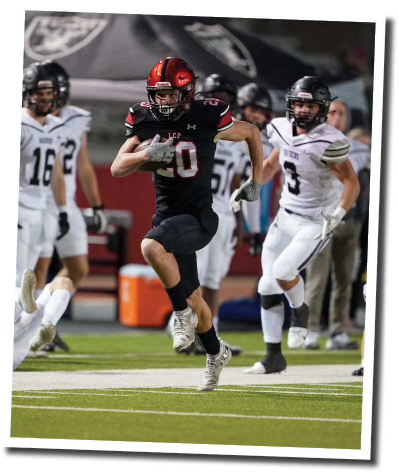 Cooper Morris (20) evades several Randall defenders and runs toward the endzone  Lubbock-Cooper vs  Randall  Photo by: Aaron Baxter