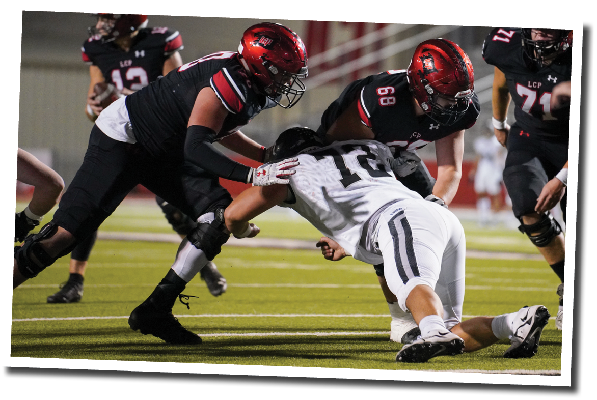 Holton Hendrix (70) and Colter Lynch (68) block a defender at the goal line  Lubbock-Cooper vs  Randall  Photo by: Aaron Baxter