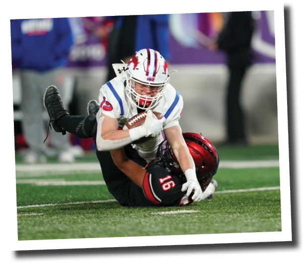Tony Cabello tackles Grapevine s Andrew Via  Lubbock-Cooper vs  Grapevine  Photo by: Aaron Baxter