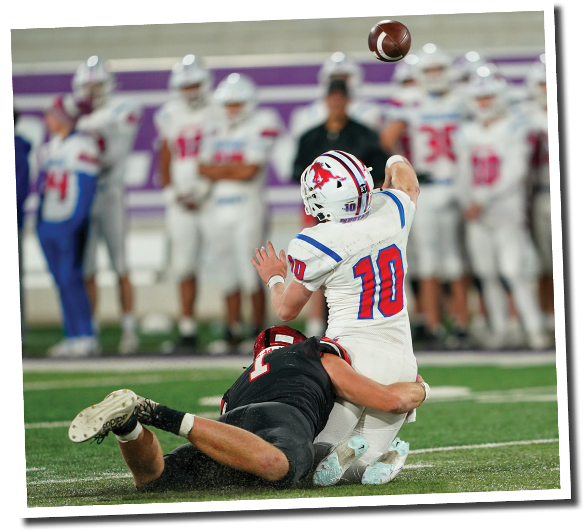 Kyler Jordan takes down Colt Mercer as he passes the ball  Lubbock-Cooper vs  Grapevine  Photo by: Aaron Baxter