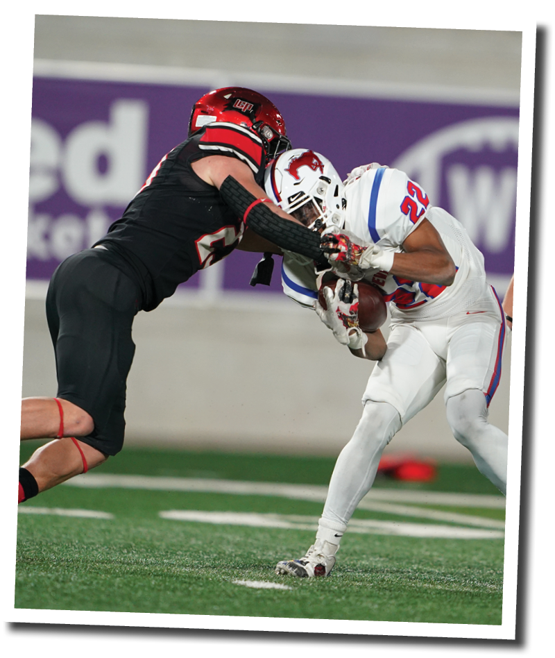 Kyle Lewis tackles CJ Holmes on a kickoff  Lubbock-Cooper vs  Grapevine  Photo by: Aaron Baxter