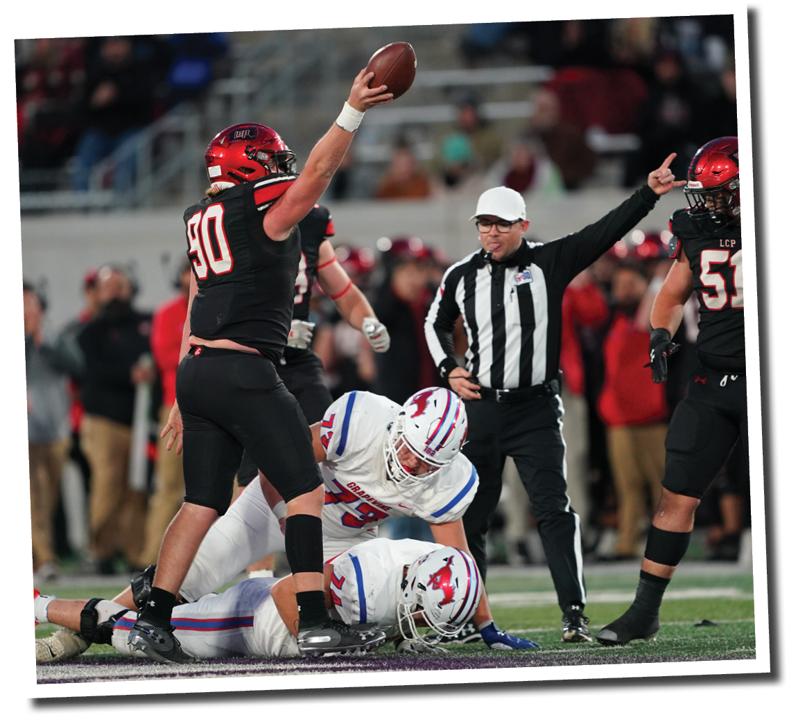 Timothy Haynes emerges with the football after Kyler Jordan forces a fumble from Grapevine s Colt Mercer  Lubbock-Cooper vs  Grapevine  Photo by: Aaron Baxter