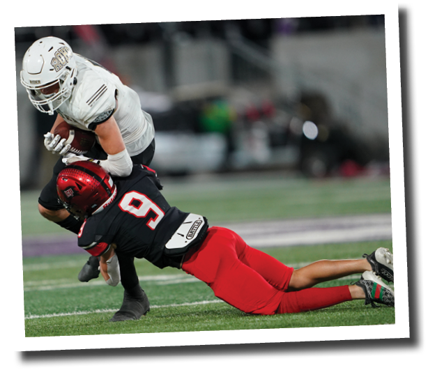 Ryson Jennings tackles Tobias Oliver  Lubbock-Cooper vs  Rider  Photo by: Aaron Baxter