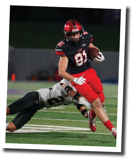 Braydon Laws take a pass in the flat and avoids a defender  Lubbock-Cooper vs  Rider  Photo by: Aaron Baxter