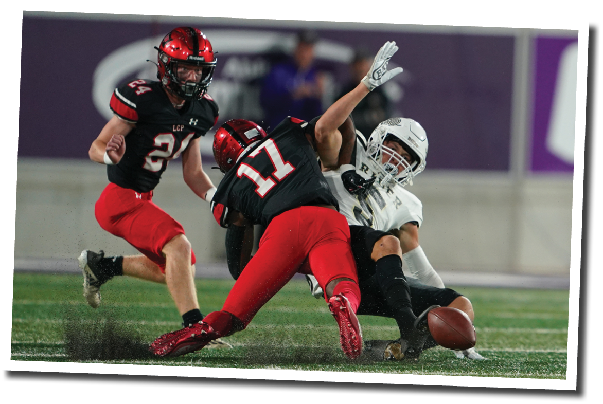 Ju Raylin Shaw punches the ball out of the hands of Raider WR Tobias Oliver  Lubbock-Cooper vs  Rider  Photo by: Aaron Baxter