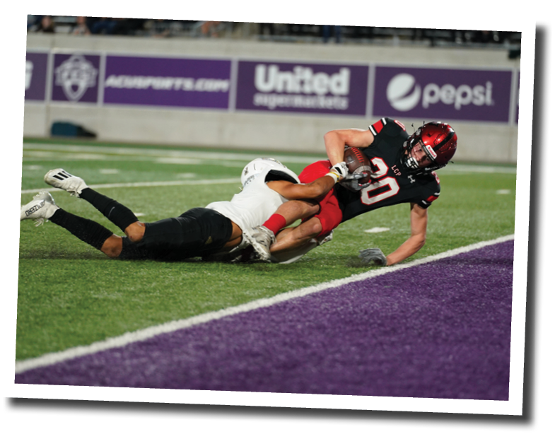 Cooper Morris dives into the endzone  Lubbock-Cooper vs  Rider  Photo by: Aaron Baxter
