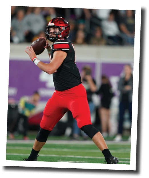 Pirate QB Holt Gibson rolls right and throws a pass  Lubbock-Cooper vs  Rider  Photo by: Aaron Baxter