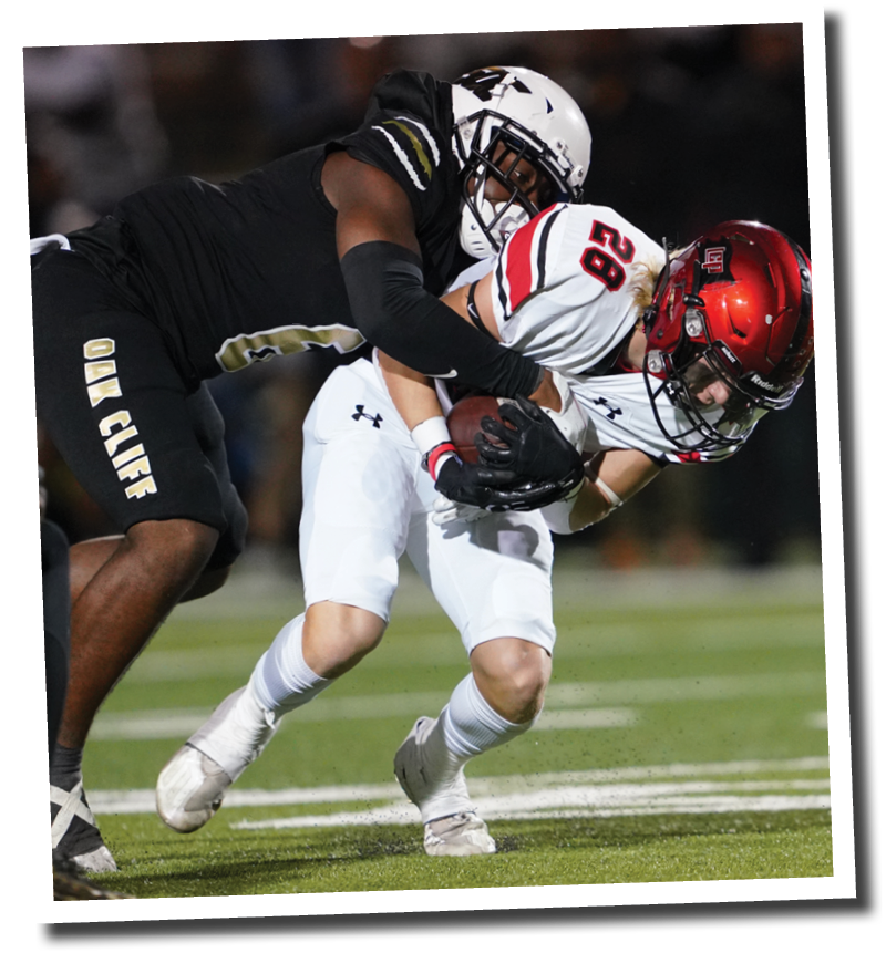 Jackson Austin is tackled after catching a pass  5A Division 2 State Semi-Final, Lubbock-Cooper vs  South Oak Cliff  Photo by: Aaron Baxter