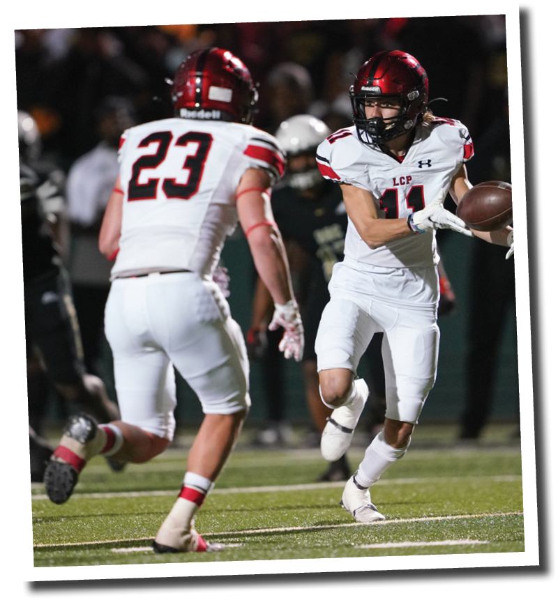 Hayden Brooks (11) tosses the ball to Kyle Lewis (23) on a kick return  5A Division 2 State Semi-Final, Lubbock-Cooper vs  South Oak Cliff  Photo by: Aaron Baxter