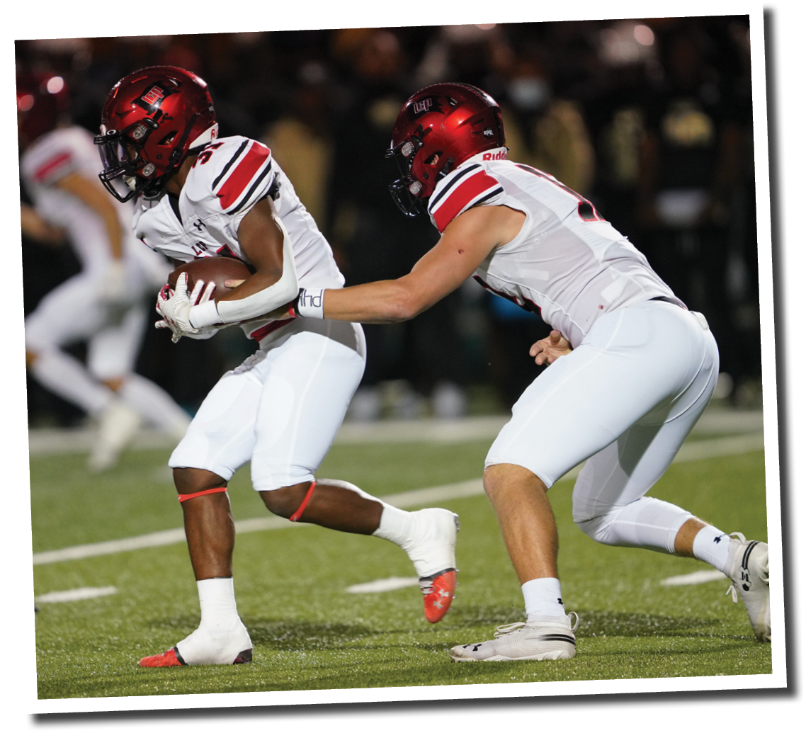 Holt Gibson hands the ball off to Kaden Chambers  5A Division 2 State Semi-Final, Lubbock-Cooper vs  South Oak Cliff  Photo by: Aaron Baxter