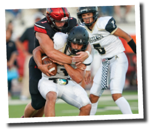 Kyler Jordan (1) takes down Brock Tijerina (21) for a loss  Lubbock-Cooper vs  Andrews  Photo by: Aaron Baxter