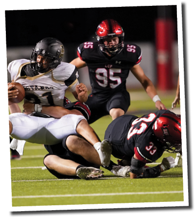 Timothy Haynes (90) and Cameron Jones (33) bring down Mustang RB Brock Tijernia (21)  Lubbock-Cooper vs  Andrews  Photo by: Aaron Baxter