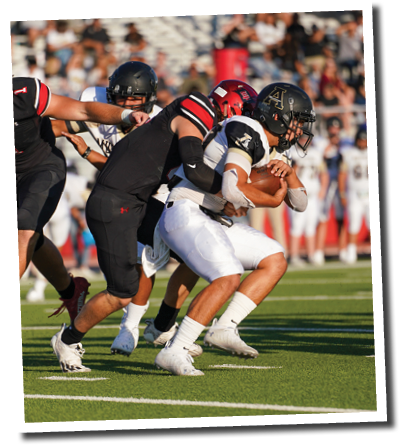 Landen Dorris (65) tackles Andrews' Brock Tijerina (21)  Lubbock-Cooper vs  Andrews  Photo by: Aaron Baxter