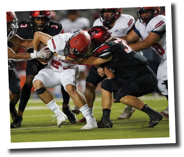 Tanner Webb (35) tackles Lane Carroll  Lubbock-Cooper vs  Plainview  Photo by: Aaron Baxter