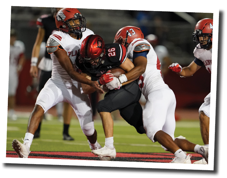 Blake Garza (26) drags multiple Bulldog defenders across midfield  Lubbock-Cooper vs  Plainview  Photo by: Aaron Baxter