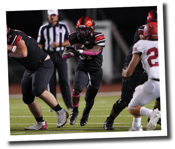 Kaden Chambers (31) runs through the gap  Lubbock-Cooper vs  Plainview  Photo by: Aaron Baxter