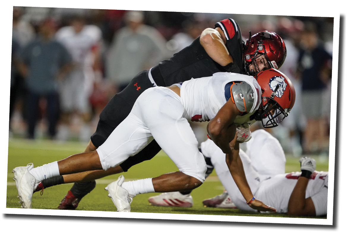 Kyler Jordan (1) tackles plainview's Jordan Wallace for a loss   Lubbock-Cooper vs  Plainview  Photo by: Aaron Baxter