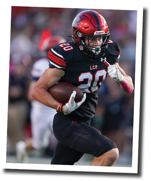 Cooper Morris (20) grabs a pass and turns upfield  Lubbock-Cooper vs  Plainview  Photo by: Aaron Baxter