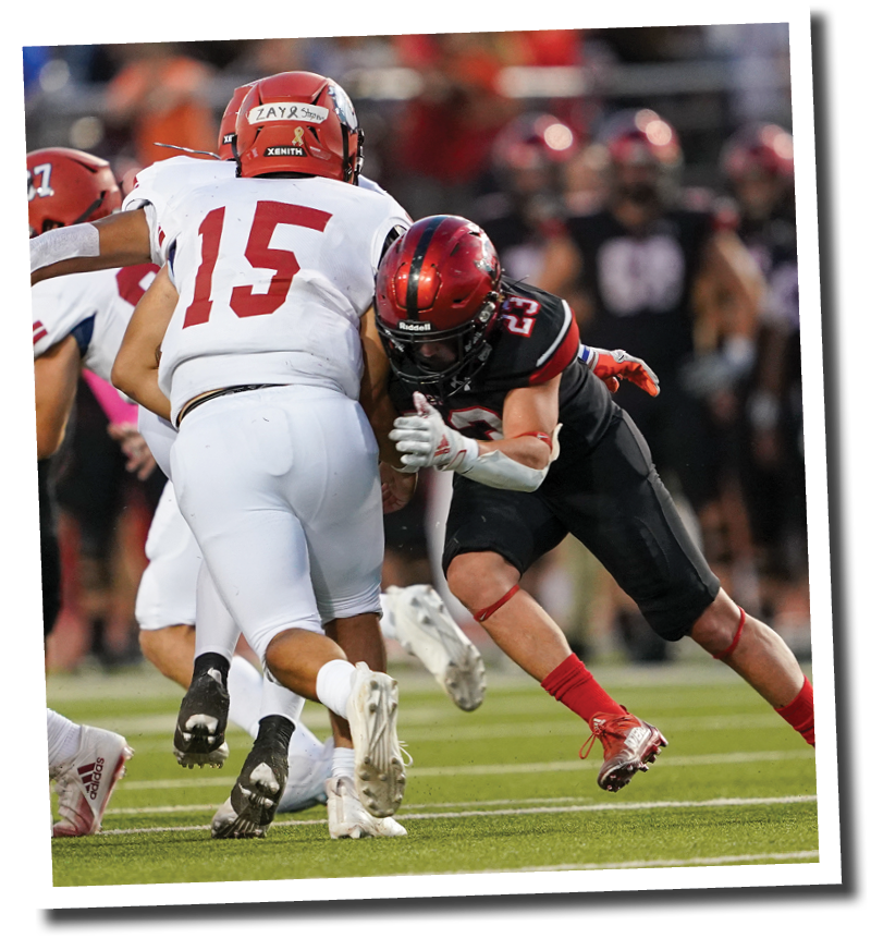 Kyle Lewis (23) tackles Plainview quarterback Isaac Garza  Lubbock-Cooper vs  Plainview  Photo by: Aaron Baxter