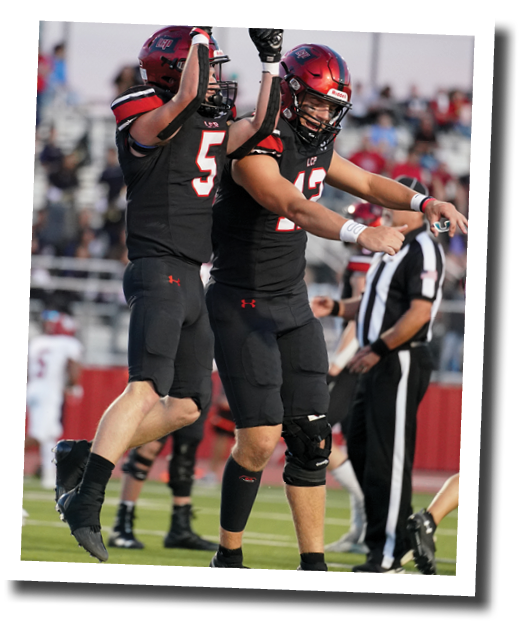 Judge Thomason (5) celebrates after a touchdown with quarterback Holt Gibson (12)  Lubbock-Cooper vs  Plainview  Photo by: Aaron Baxter