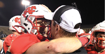 SHENANDOAH, TX - DECEMBER 20: Andrew Kamienski #11 and head coach Jeff Thorne of the North Central Cardinals celebrate during the Division III Men's Football Championship held at Woodforest Bank Stadium on December 20, 2019 in Shenandoah, Texas. North Central defeated Wisconsin-Whitewater 41-14 to win the national title. (Photo by Justin Tafoya/NCAA Photos via Getty Images)