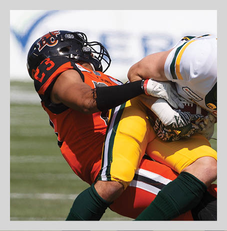 B.C. Lions Victor Gamboa (23) tackles Edmonton Eskimos Greg Ellingson (82) during first half CFL pre-season action in Edmonton, Alta., on Sunday May 26, 2019. THE CANADIAN PRESS/Jason Franson.